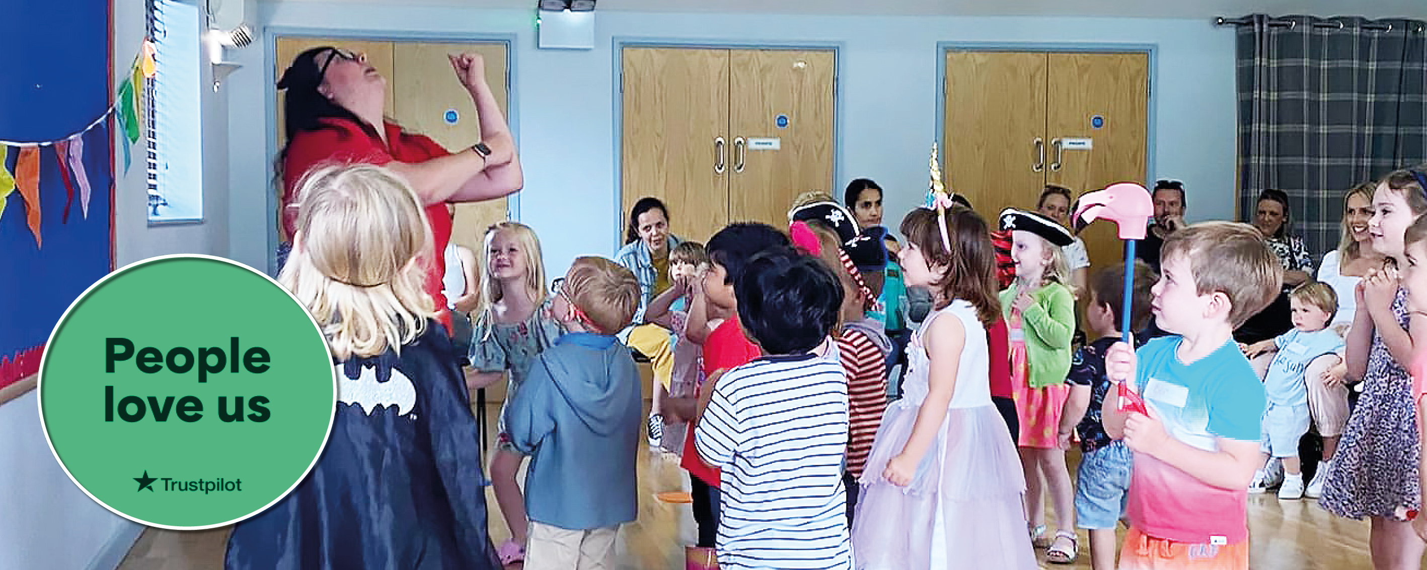 PYJAMA DRAMA TEACHER HAVING FUN AT A BIRTHDAY PARTY.